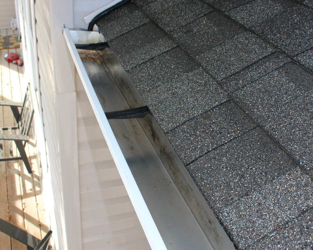 A gutter after being professionally cleaned